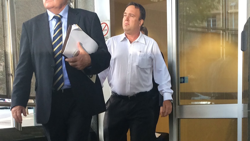 Former Queensland detective Mick Featherstone leaves the Brisbane watch house on Friday afternoon.