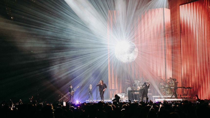 A disco ball reflecting light across the arena at Gang Of Youths' Perth show, Sat 30 July 2022