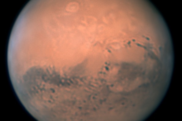 Close-up picture of Mars, showing its well-known features including Olympus Mons