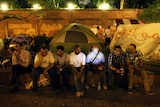 Egyptian protestors sit outside palace in Cairo