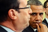 Pressure mounting ... Barack Obama and Francois Hollande speak prior to the G8 summit.