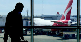 Man walks by airport window