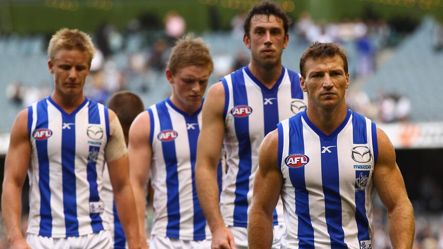 Keeping the faith: Brad Scott spares his players the axe for their trip west to meet Fremantle.