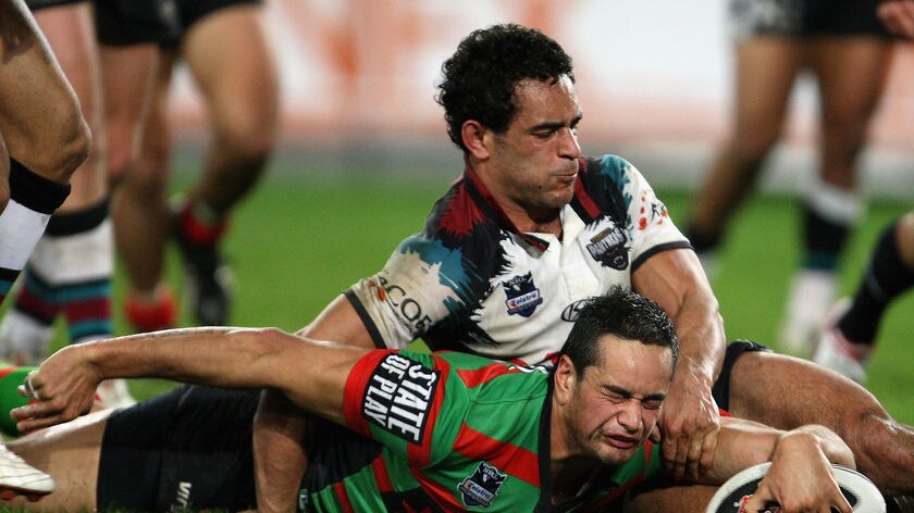 John Sutton dives over to score for the Rabbitohs