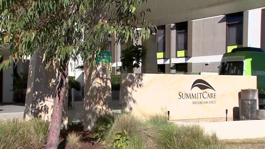 Exterior of a building with a sign that reads: Summit Care.