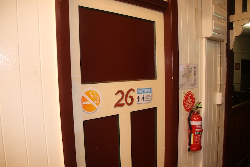 An old door with the number 26 on the front