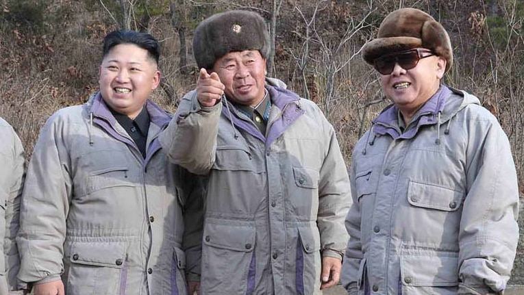 Kim Jong-un (L) and Kim Jong-il (R)