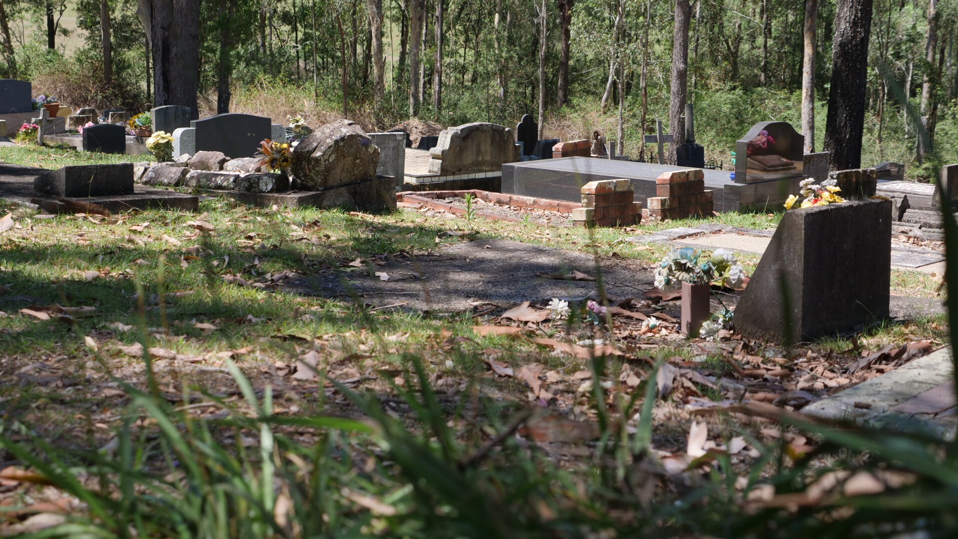 A regional cemetery, with bushland around the gravestones.