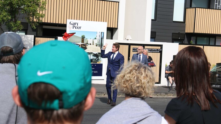 A property auctioneer at work on a Melbourne street.