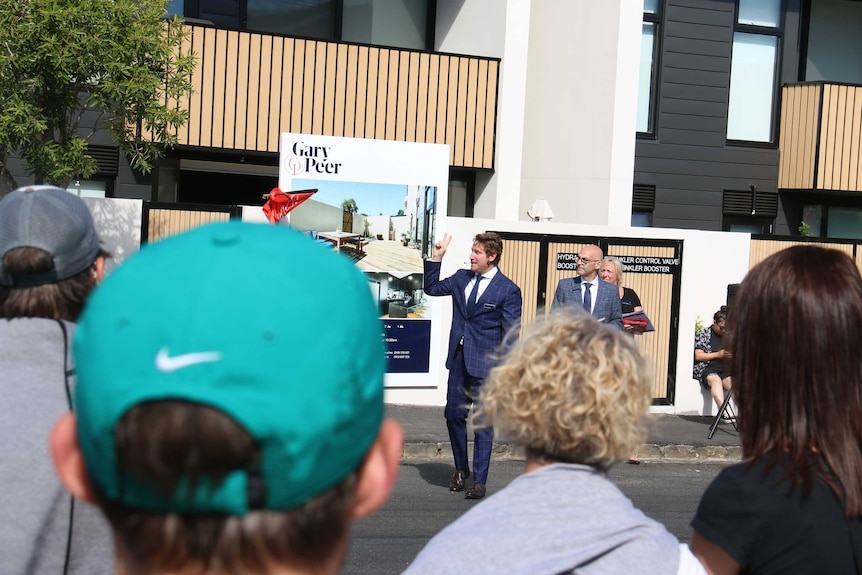 A property auctioneer at work on a Melbourne street.