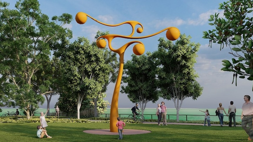 a design of an orange sculpture with what appears to be mangoes hanging off it