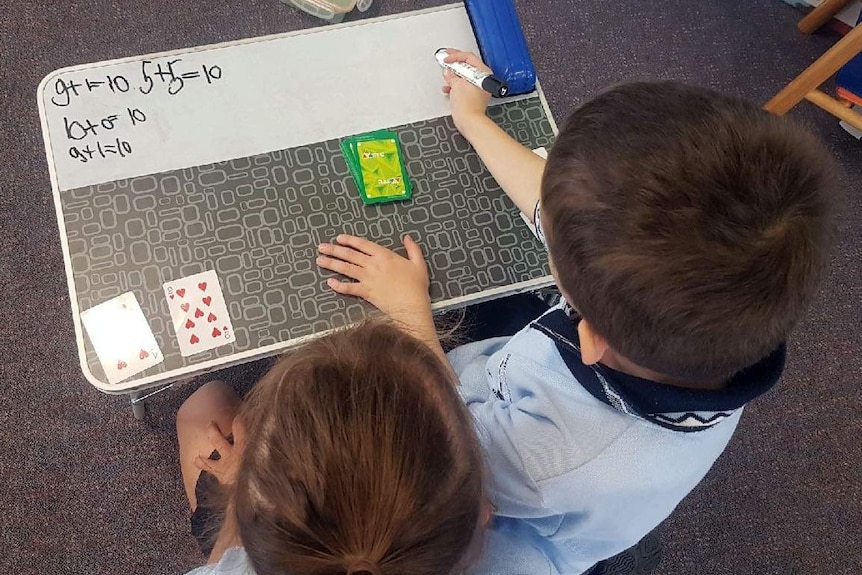 Two young students take part in a formative assessment