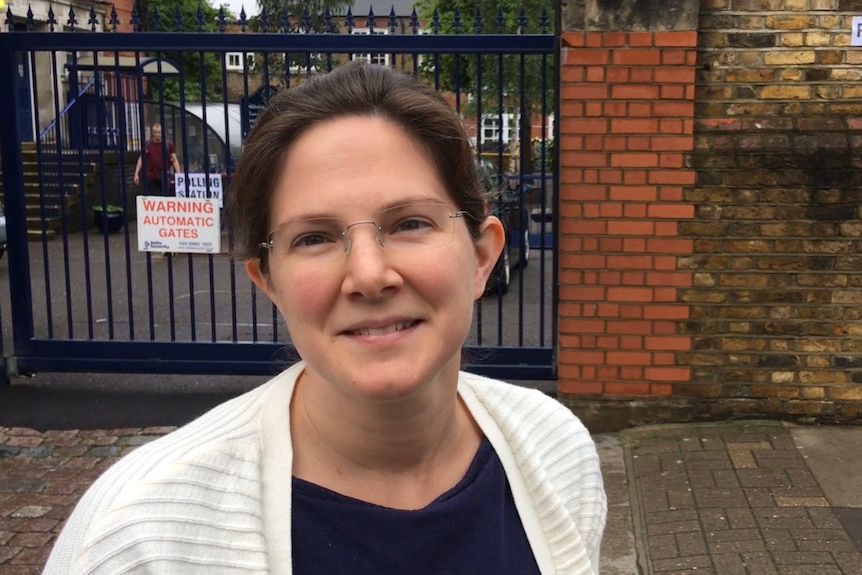 Jennifer outside a polling station