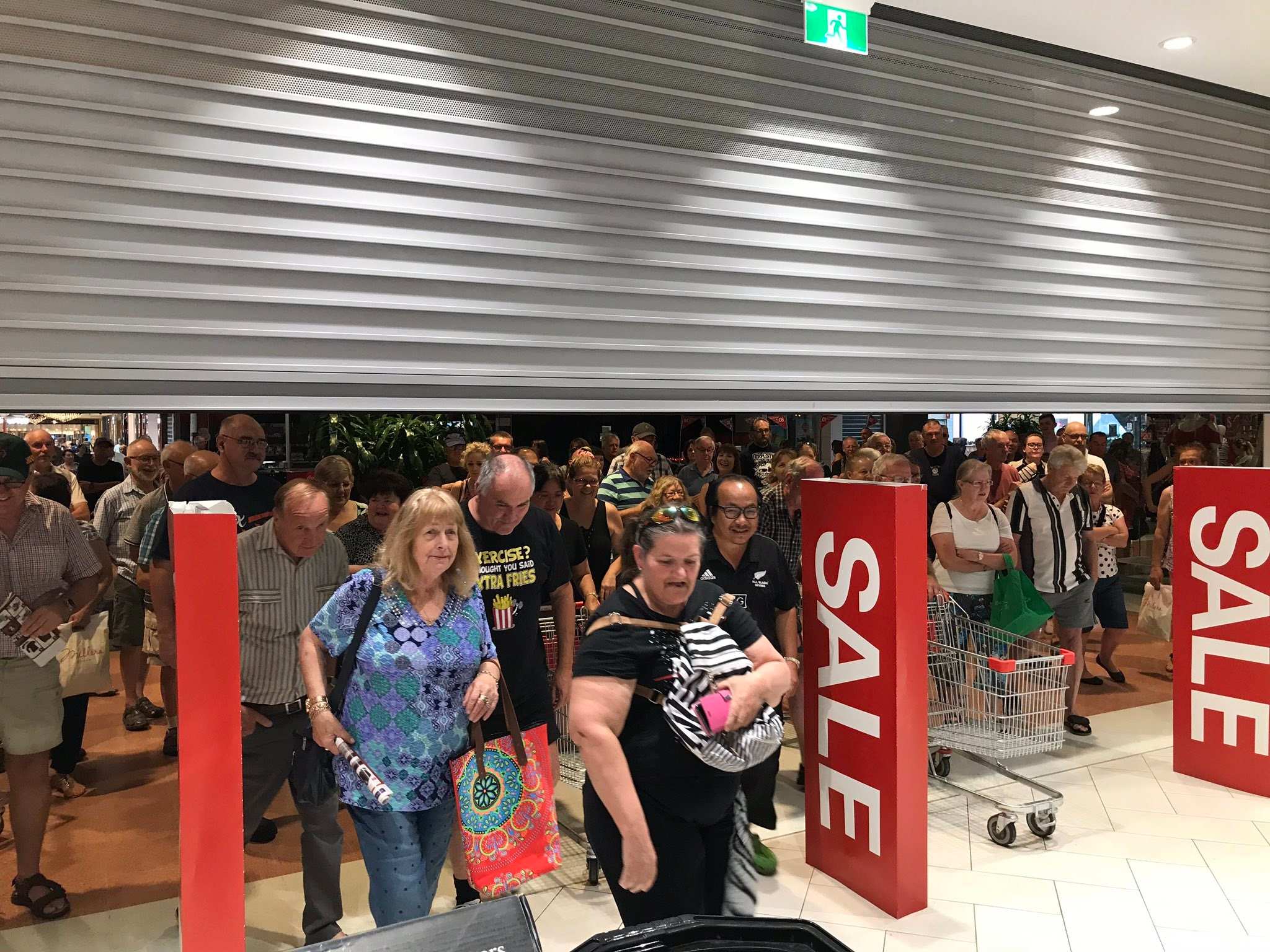 Shoppers rushing in to grab sales.
