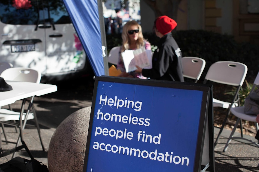 'Helping homeless people find accommodation' written on a NSW family and community services sign