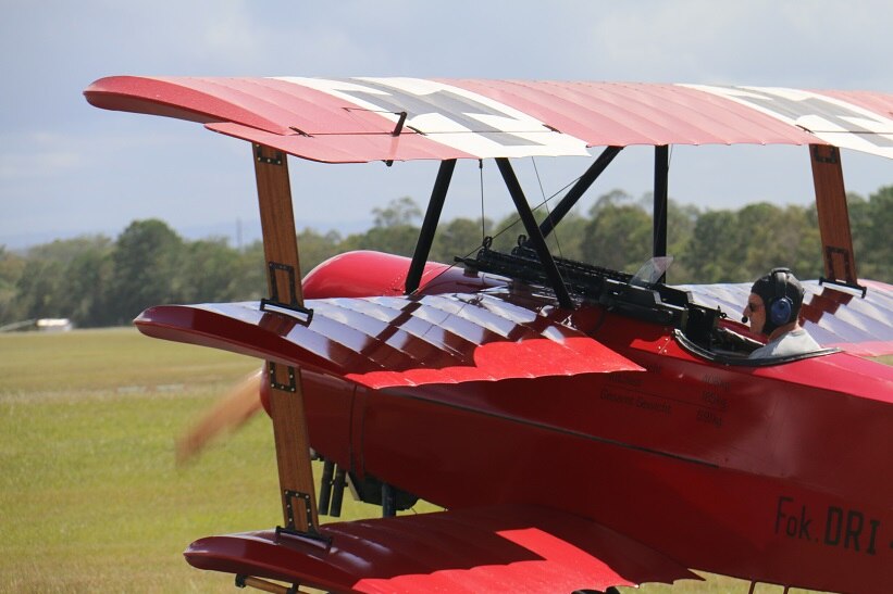 An experienced pilot in a replica Fokker DR.1