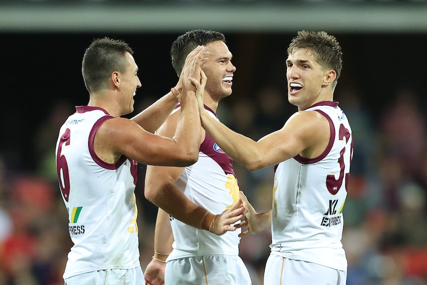 Zac Bailey high-fives Hugh McCluggage with a smile on his face