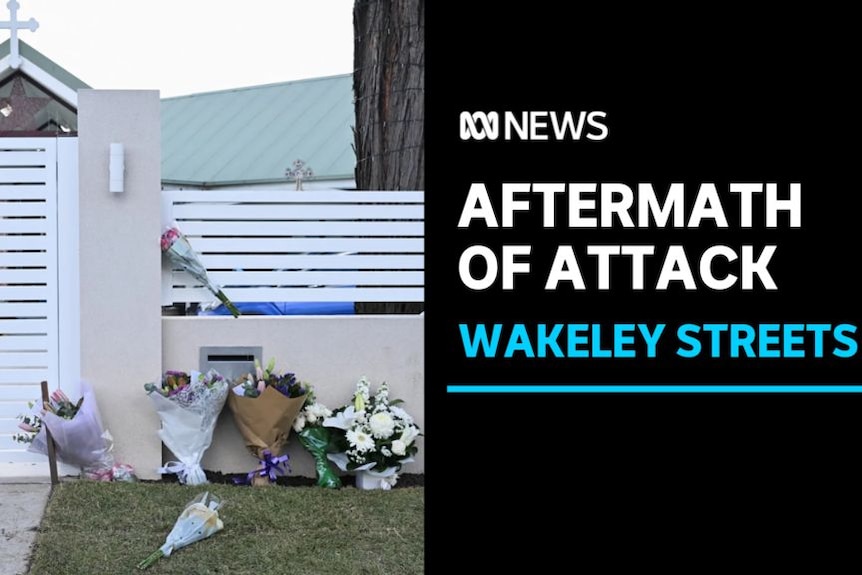 Aftermath of Attack, Wakeley Streets: Floral tributes lie against a church wall.