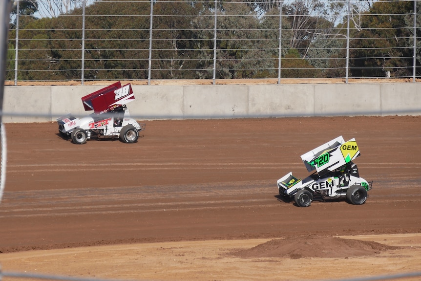 Two sprintcars on a dirt track