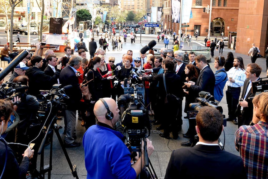 A media throng surrounds Pauline Hanson