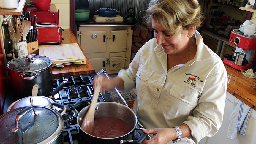 Roxanne Hopkins in her farm kitchen making a prize-winning plum jam.