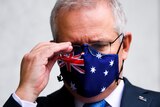 The PM with a face mask