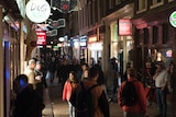 Night-time revellers fill the streets in Amsterdam's historic centre