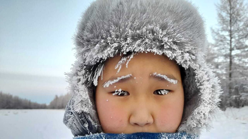 Anna Sleptsova's grandson Arsen rugged up in the snow.