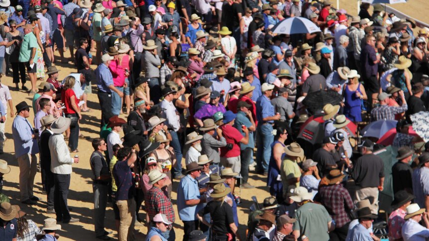 An overhead shot looking down at crowds at the Birdsville Races.