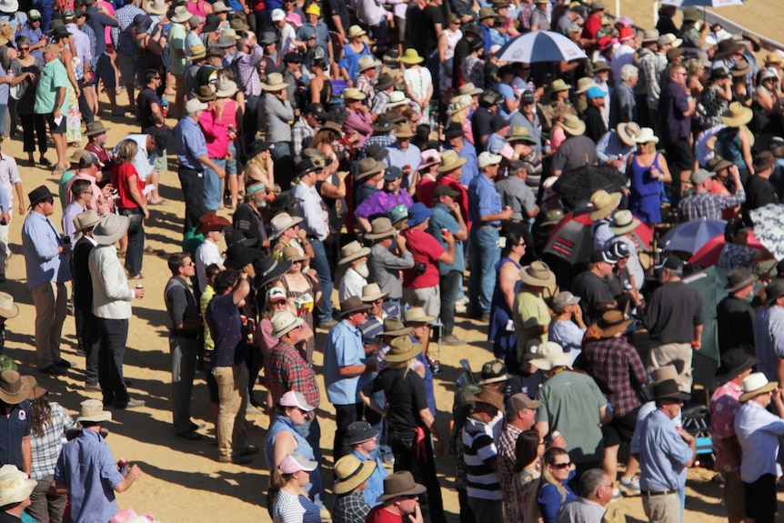An overhead shot looking down at crowds at the Birdsville Races.