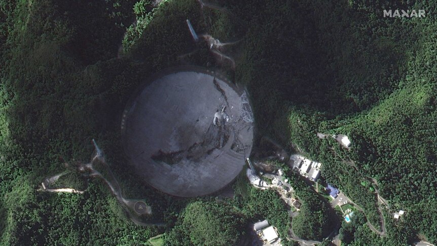 A satellite photo of the Arecibo Observatory's telescope after it collapsed