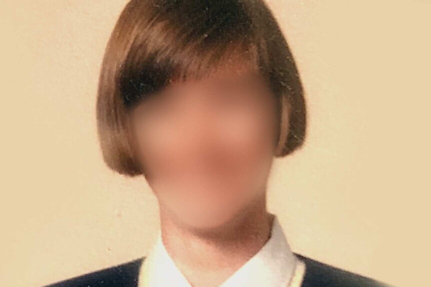Blurred profile photo of a young woman with a bob hair.