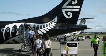 Passengers board an Air New Zealand flight at Christchurch Airport