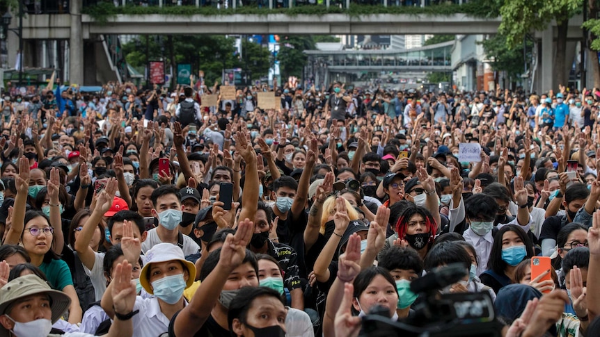 Protesters hold up three fingers during anti-Government demonstrations in Bangkok, Thailand.