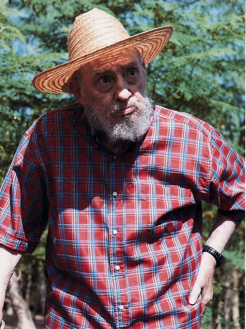 Fidel Castro released a series of photos of him standing in a field with a cane.