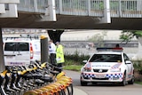 Police at the scene where a woman's body was found near the Kurilpa Bridge at South Brisbane.