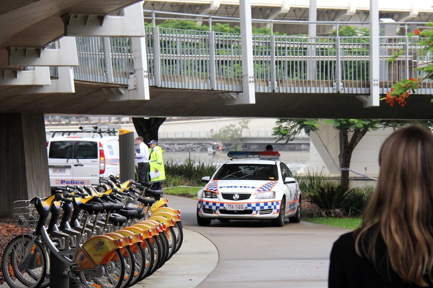 Police at the scene where a woman's body was found near the Kurilpa Bridge at South Brisbane.