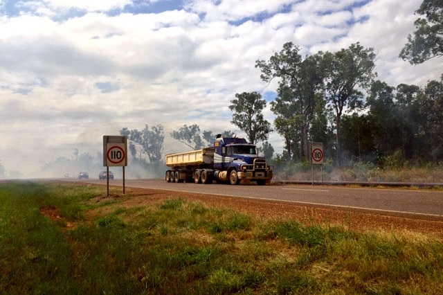 Traffic driving through smoke near Darwin