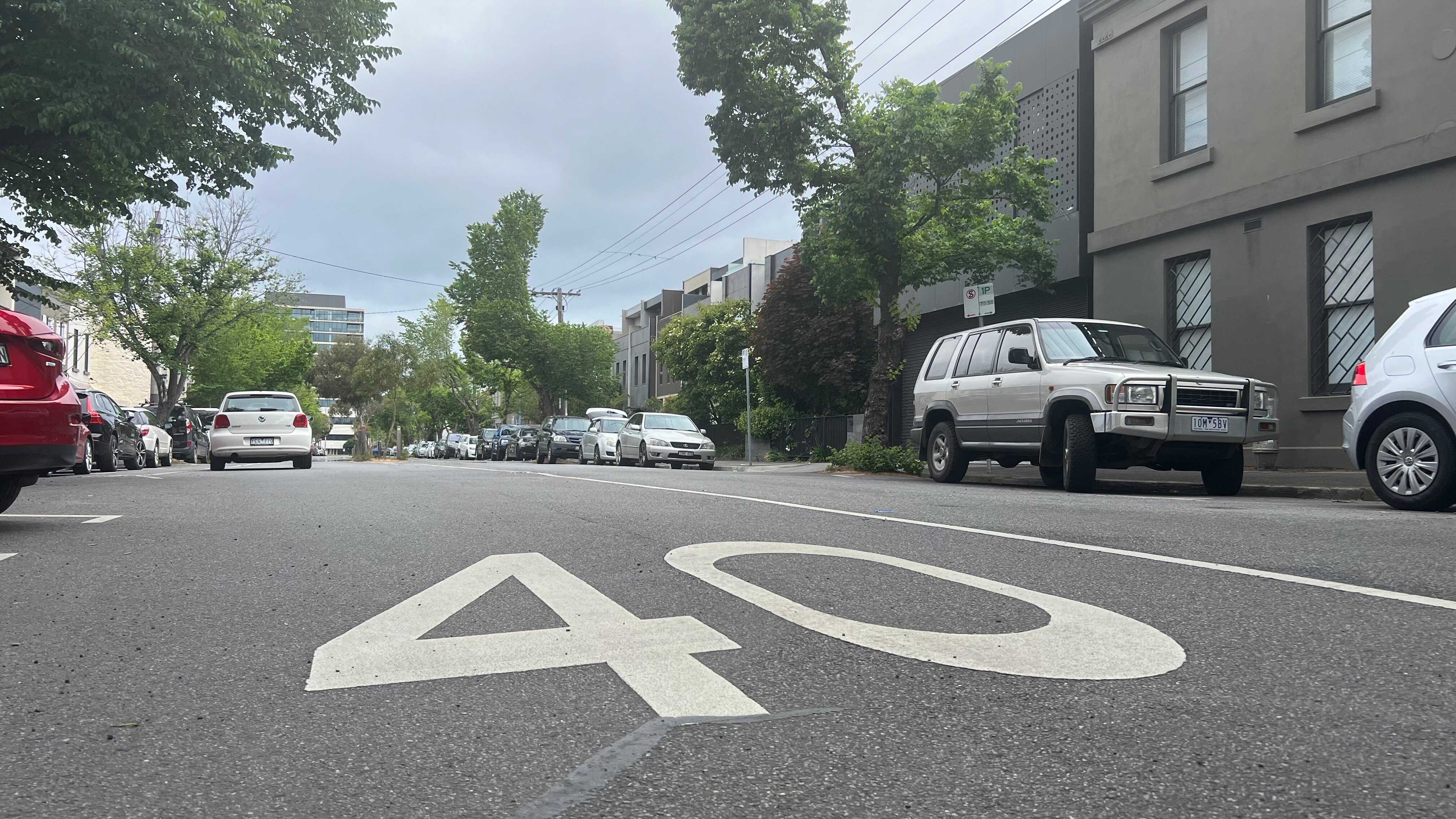 Parked cars line the streets of inner city Melbourne suburbs.