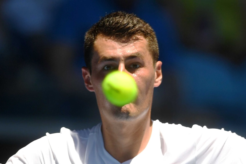 Australia's Bernard Tomic plays a shot against Brazil's Thomaz Bellucci at the Australian Open.