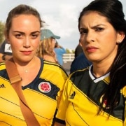 A group of women in Colombia soccer jerseys