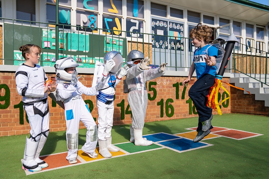 Primary school students in Parkes celebrating the 50th anniversary of the moon landing.