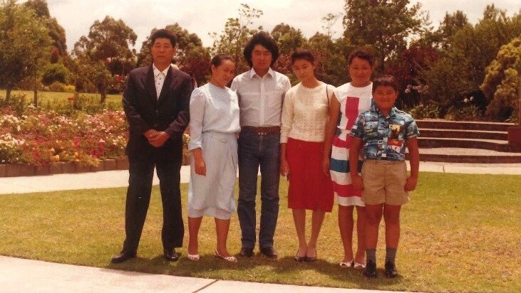 Rufina Djo and her family in the Auburn Botanical Gardens.