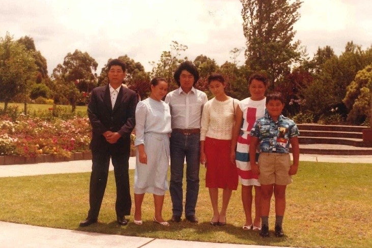 Rufina Djo and her family in the Auburn Botanical Gardens.