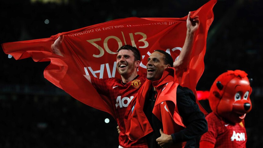 Twentieth title ... Michael Carrick and Rio Ferdinand celebrate another United title