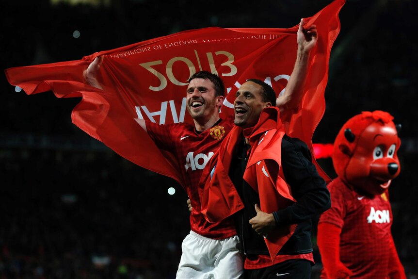 Twentieth title ... Michael Carrick and Rio Ferdinand celebrate another United title