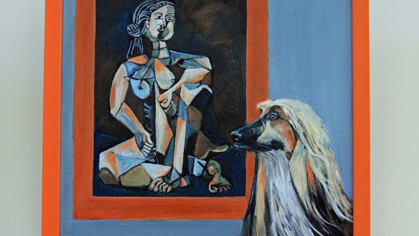 A painting of a dog next to a painting