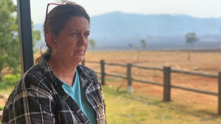 Cathy Boys stands on her verandah at her Lake Mary Road property in central Queensland