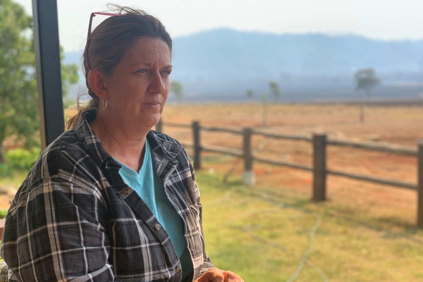 Cathy Boys stands on her verandah at her Lake Mary Road property in central Queensland