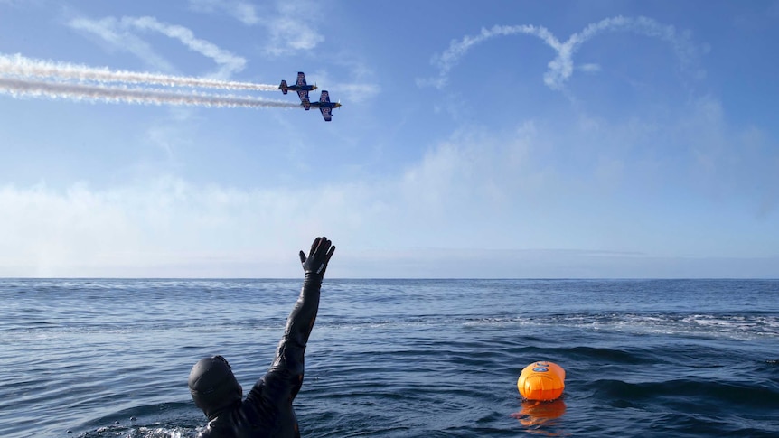 British adventurer Ross Edgley celebrates 100 days at sea, a moment marked by a fly over from an aerobatic display team.